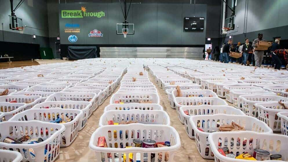 hundreds of baskets of food assembled for Thanksgiving giveaway event