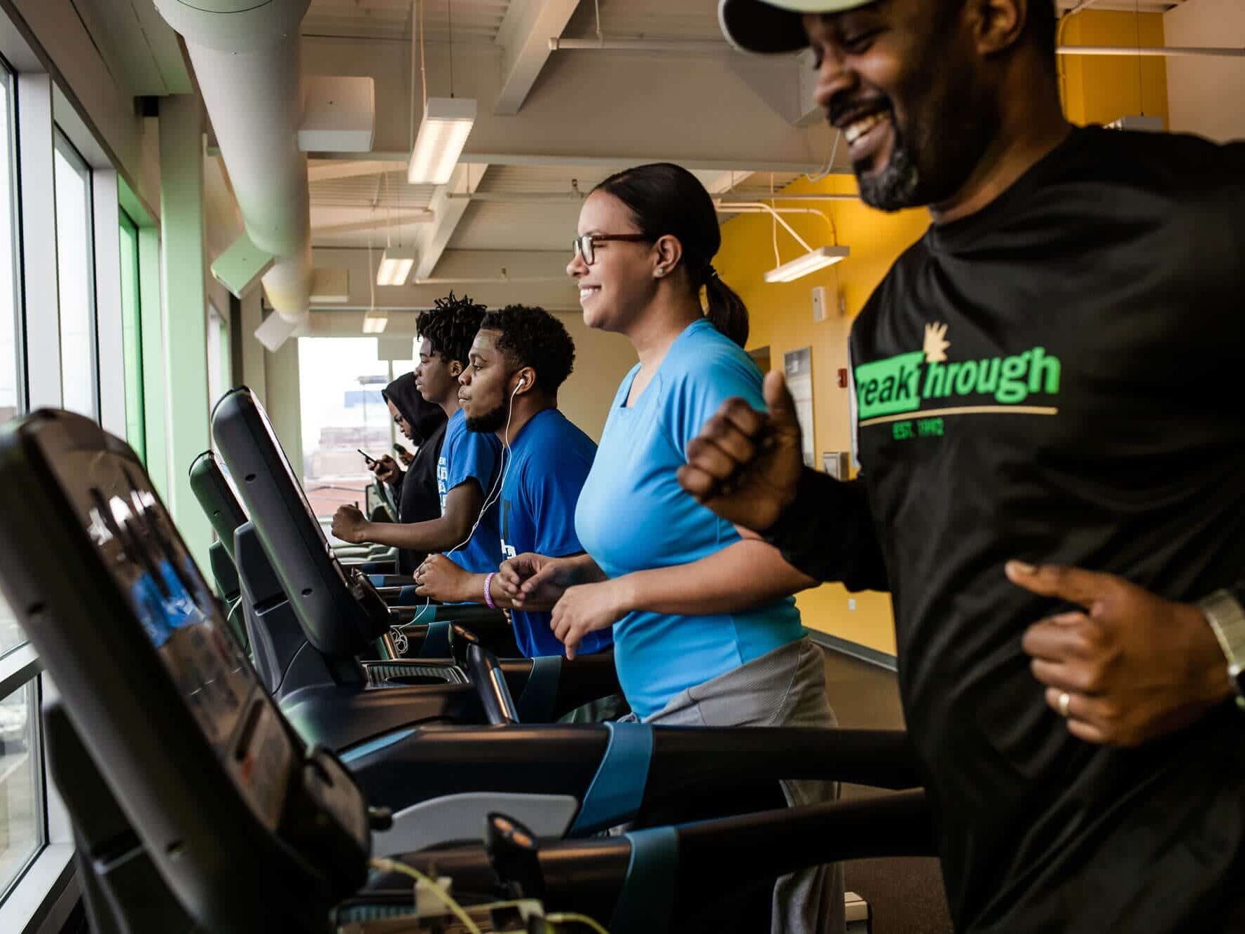 Runners on treadmills at the Breakthrough Fitness Center