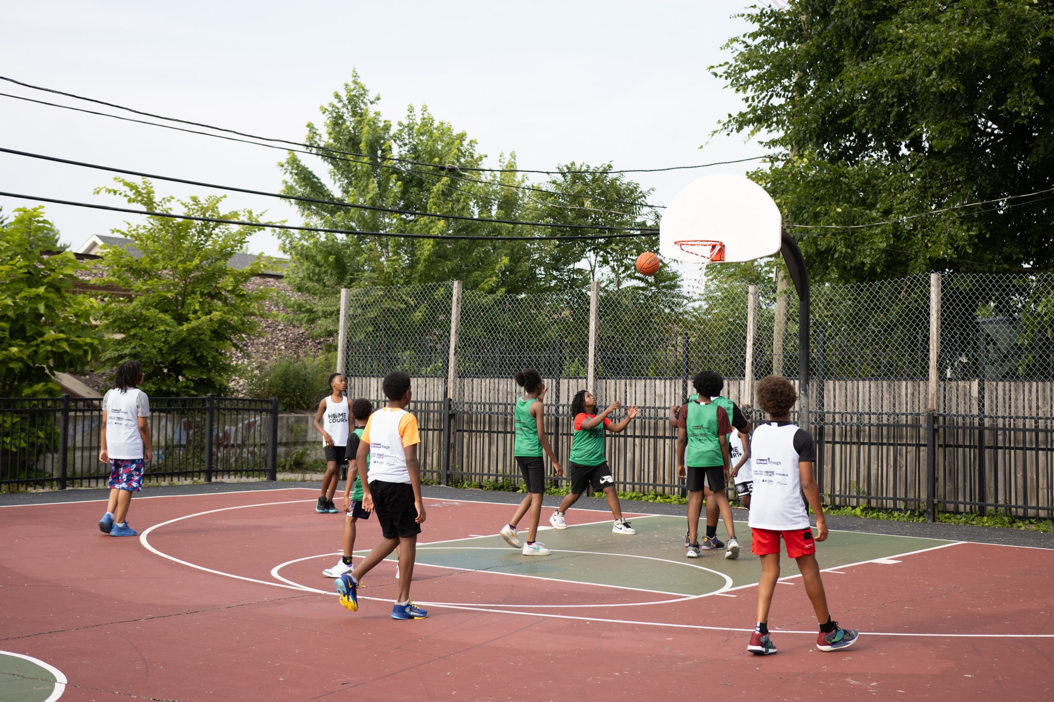 HomeCourt youth playing on basketball court